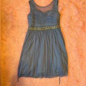 Light blue mini dress with ties and jewel details. Size 12 from Xtraordinary.